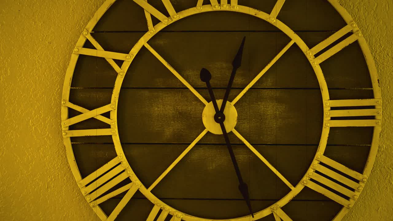 Vintage Wall Clock with Roman Numerals Showing Time Passing