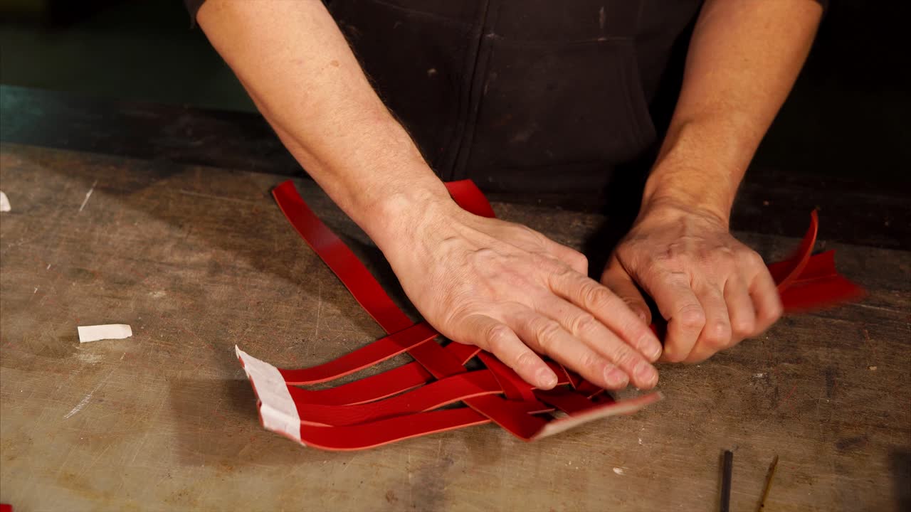 Artisan crafting red leather