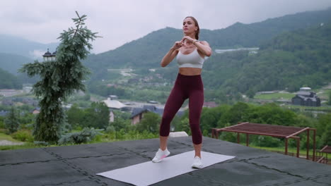 woman exercising outdoors in a mountain view