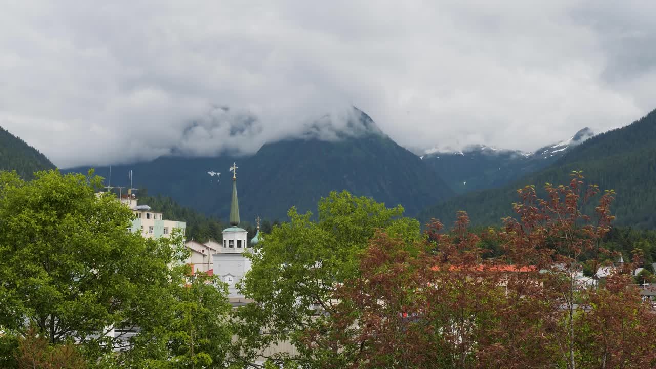 St. Michael's Cathedral, Sitka, Alaska, viewed from the Baranof Castle State Historic Site.Mount Verstovia covered by dense fog in the background.