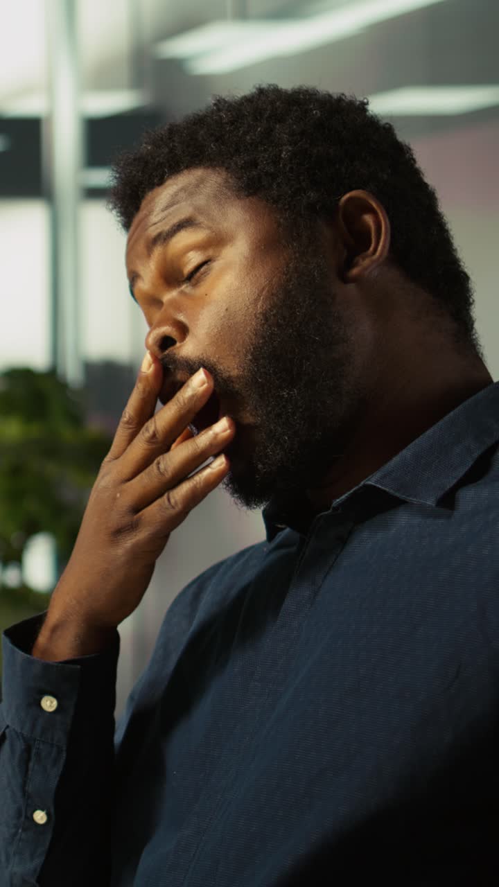 Vertical video Worker in office reviewing financial graphs, analyzing performance metrics