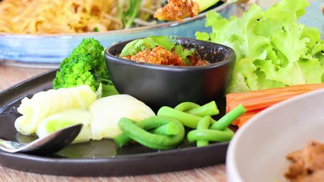 assembling fresh vegetables on a plate over time.