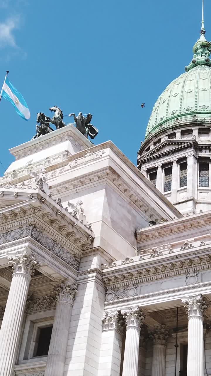National Flag waves at Congress building of Buenos Aires Argentina, Vertical view over daylight skyline