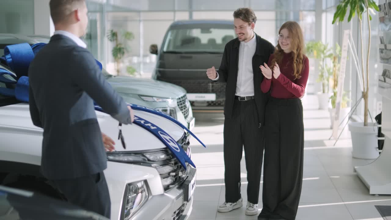 Couple Buying New Car at Dealership