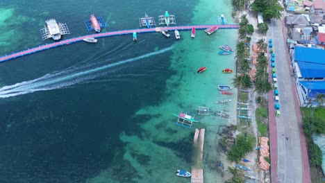 beautiful 4k drone footage of boracay jetty port with colorful boats, outriggers, and turquoise waters—perfect for travel, tourism, and tropical destination media in the philippines