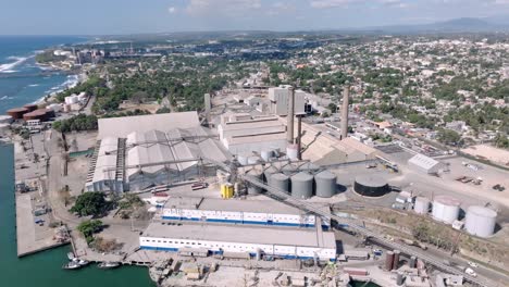 aerial overview of oil refining industry building on the seaside in dominican republic