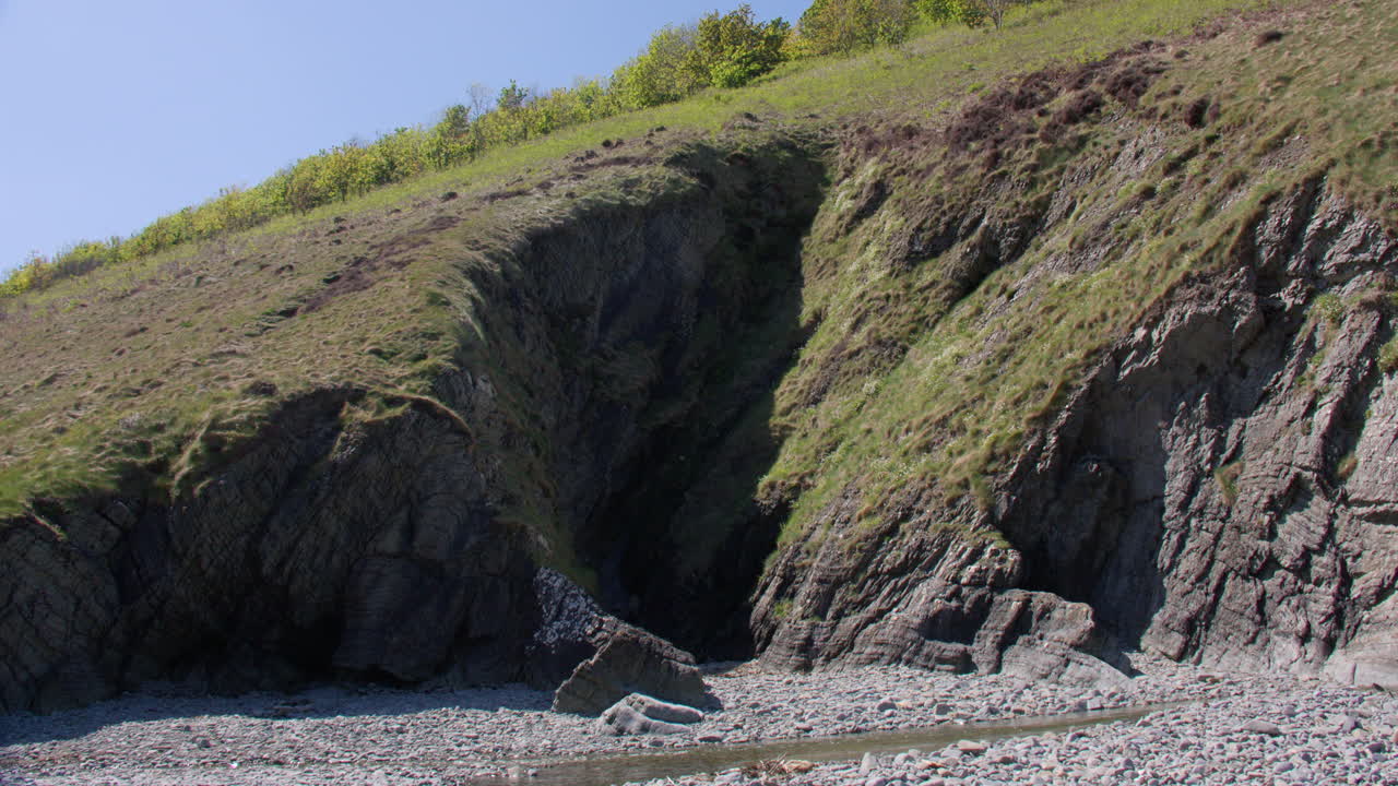 Wide shot of the caves at Cwmtydu beach