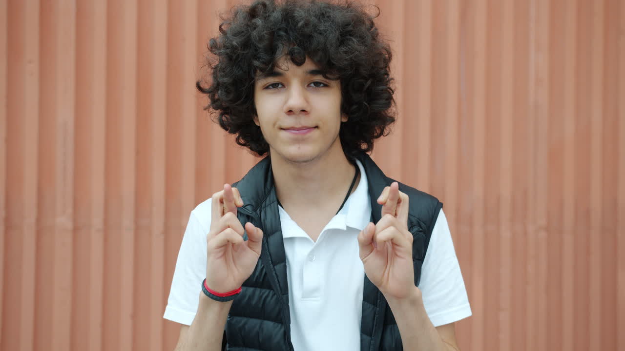 Teenager Crossing Fingers