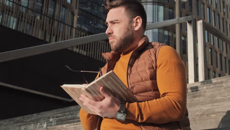 Man Taking of Glasses after Reading