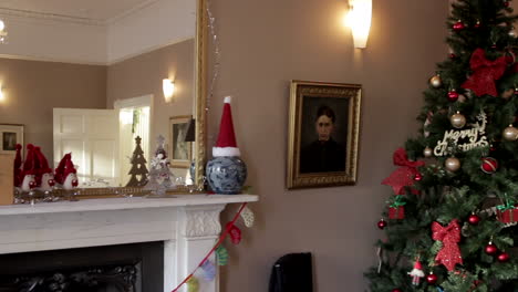 christmas tree and christmas decorations on a fireplace