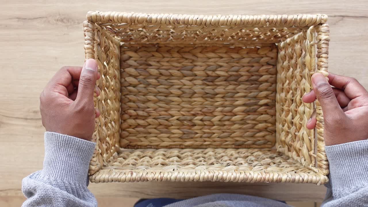 Empty Woven Rectangular Basket Held in Hands