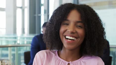 Happy-businesswoman-in-modern-office-building