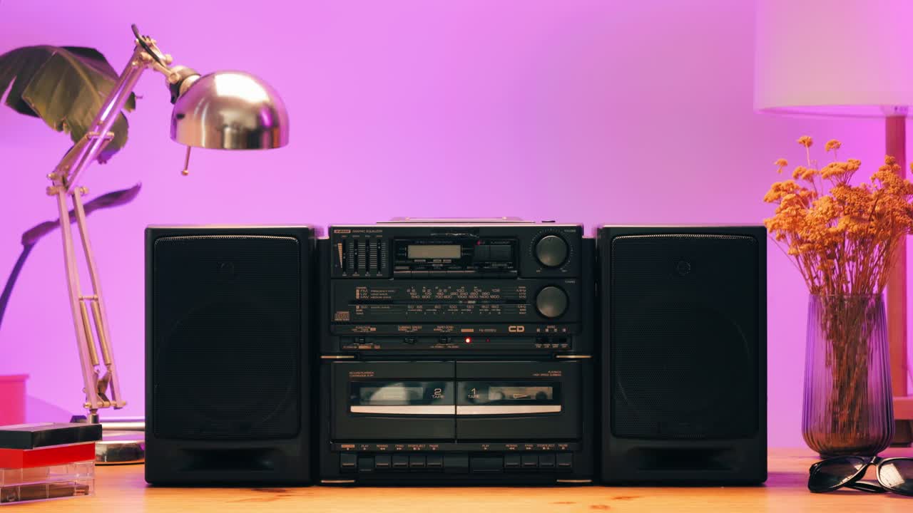 Retro radio tape recorder, audio cassette close-up. Listening to music, old radio boom box player, macro of vintage music listening. . High quality 4k footage