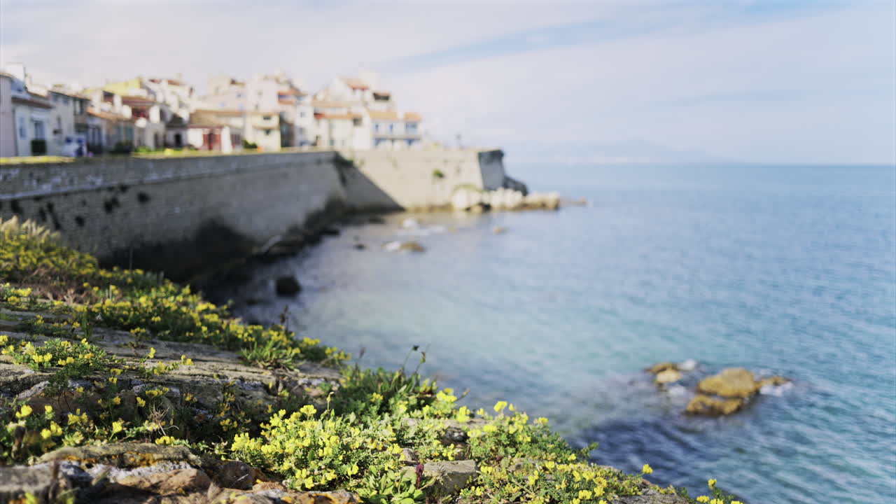 Blurred view of people walking on the coast of Antibes, France