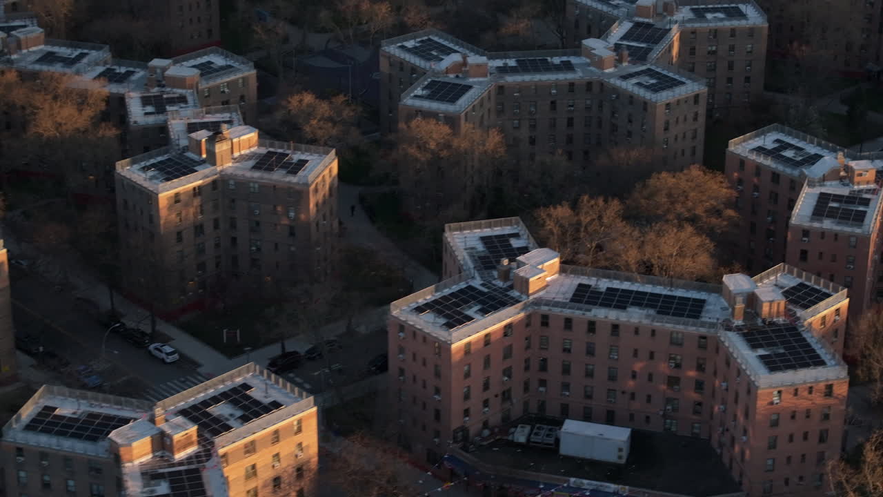 Aerial view of solar panels on public housing project buildings. Shot at sunrise in Queensbridge, Queens, New York City.
