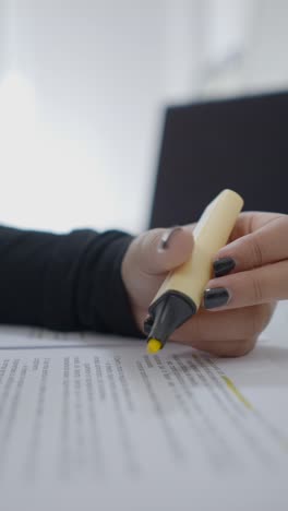 person highlighting text on a document