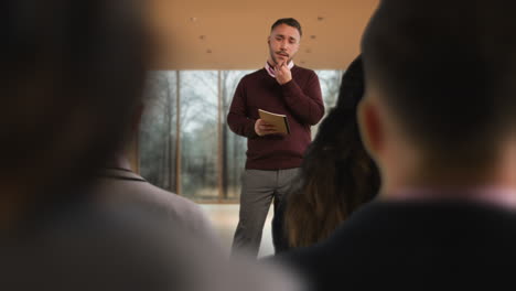 Businessman-Or-Male-College-Teacher-Giving-Presentation-Or-Lesson-In-Office-Or-Classroom-2