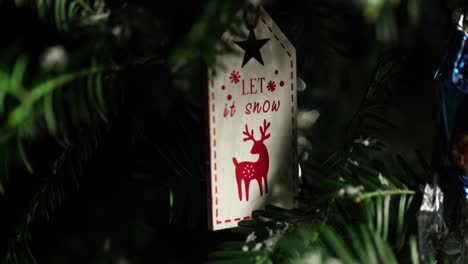 closer part view from the xmas tree "let it snow" decorated object's