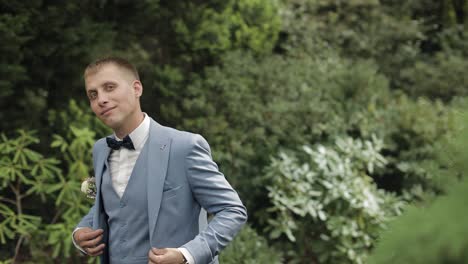 Groom,-brunette-young-man-in-the-park.-Wedding-day.-Businessman