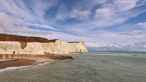 waves crashing against iconic white chalk cliffs