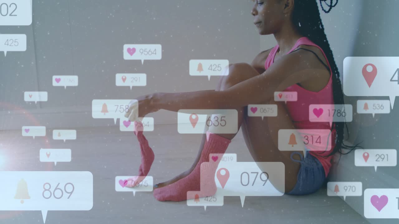 Woman lifting left sock and pulling right sock, activating social media icons rising around her