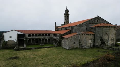 santa maria de xunqueira monastery aerial ascend shot, spain