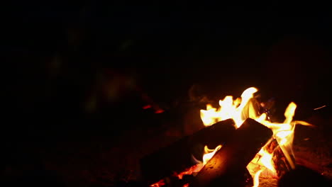 Camp-fire-burning,-crackling-and-popping-at-night