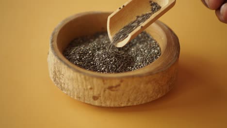 close-up of chia seeds in a wooden bowl