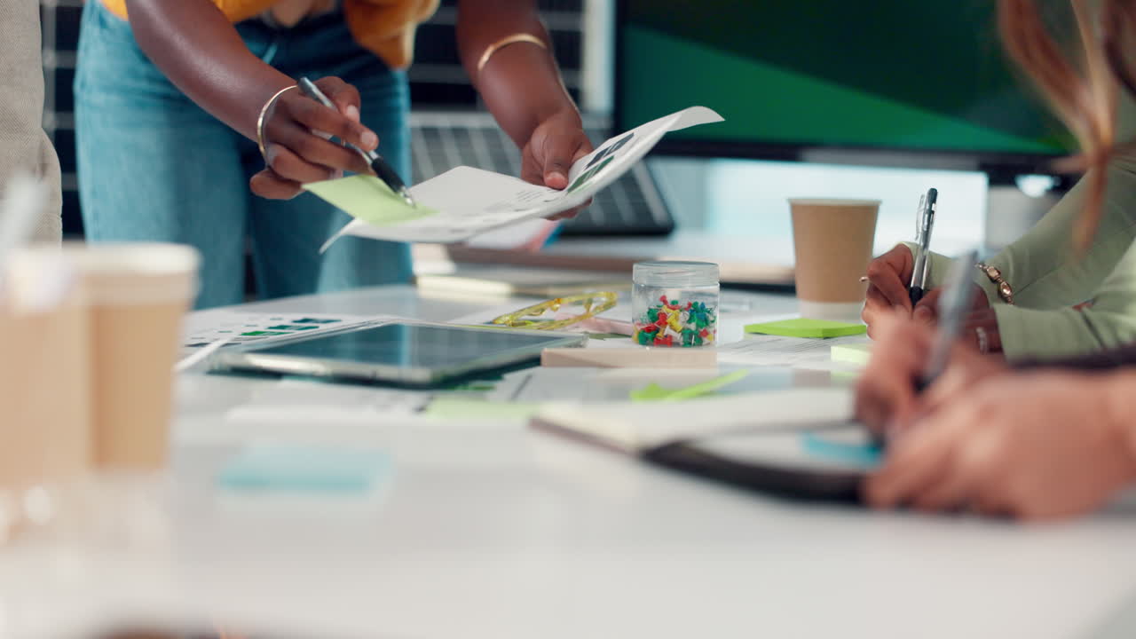 Business Team Collaborating and Discussing Documents in a Modern Office Meeting