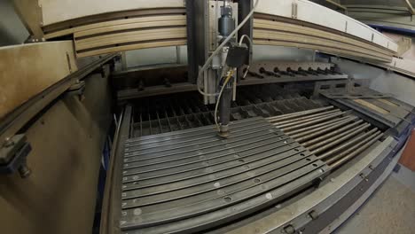 modern industrial laser cnc automated machine, metal cutting technology. laser cuts steel pipe at modern plant. time lapse.