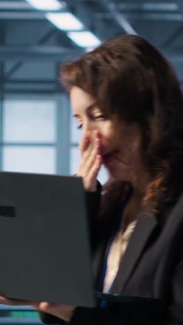 vertical video woman panicking after seeing data center getting attacked by hackers