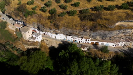 Aerial-View-Of-The-Town-Of-Setenil-de-las-Bodegas-In-The-Province-Of-Cadiz,-Andalusia,-Spain---drone-shot