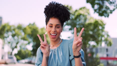 black woman with face and peace hand sign