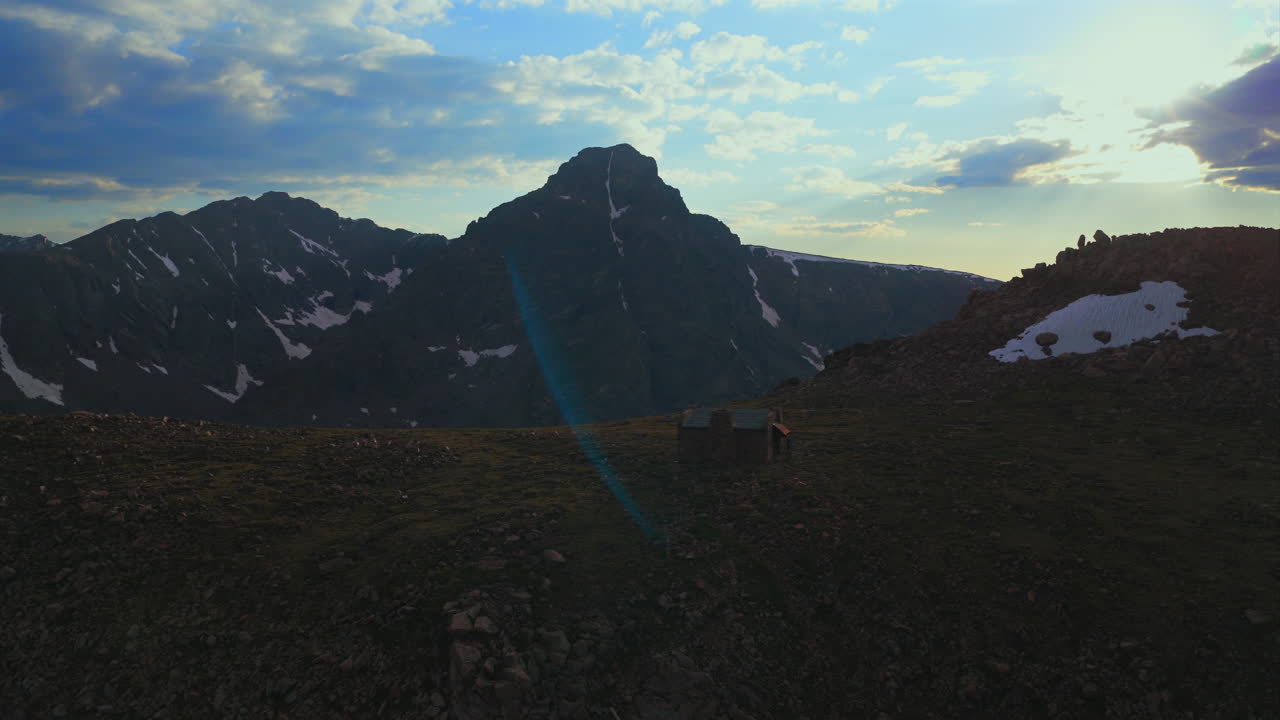 Notch Mountain shelter Halo Ridge landscape view of Mount of the Holy Cross 14er peak wilderness aerial drone Colorado summer afternoon sunset clouds Rocky Mountains Sawatch Range circle right