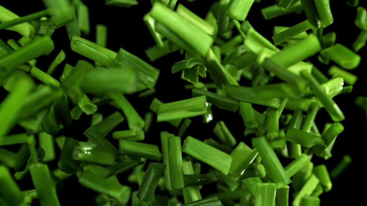 Fresh Chopped Green Onions Falling in Slow Motion