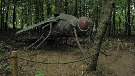 Fly-Statue-Model-In-Kashubian-Park-Of-Giants,-Strysza-Buda,-Poland