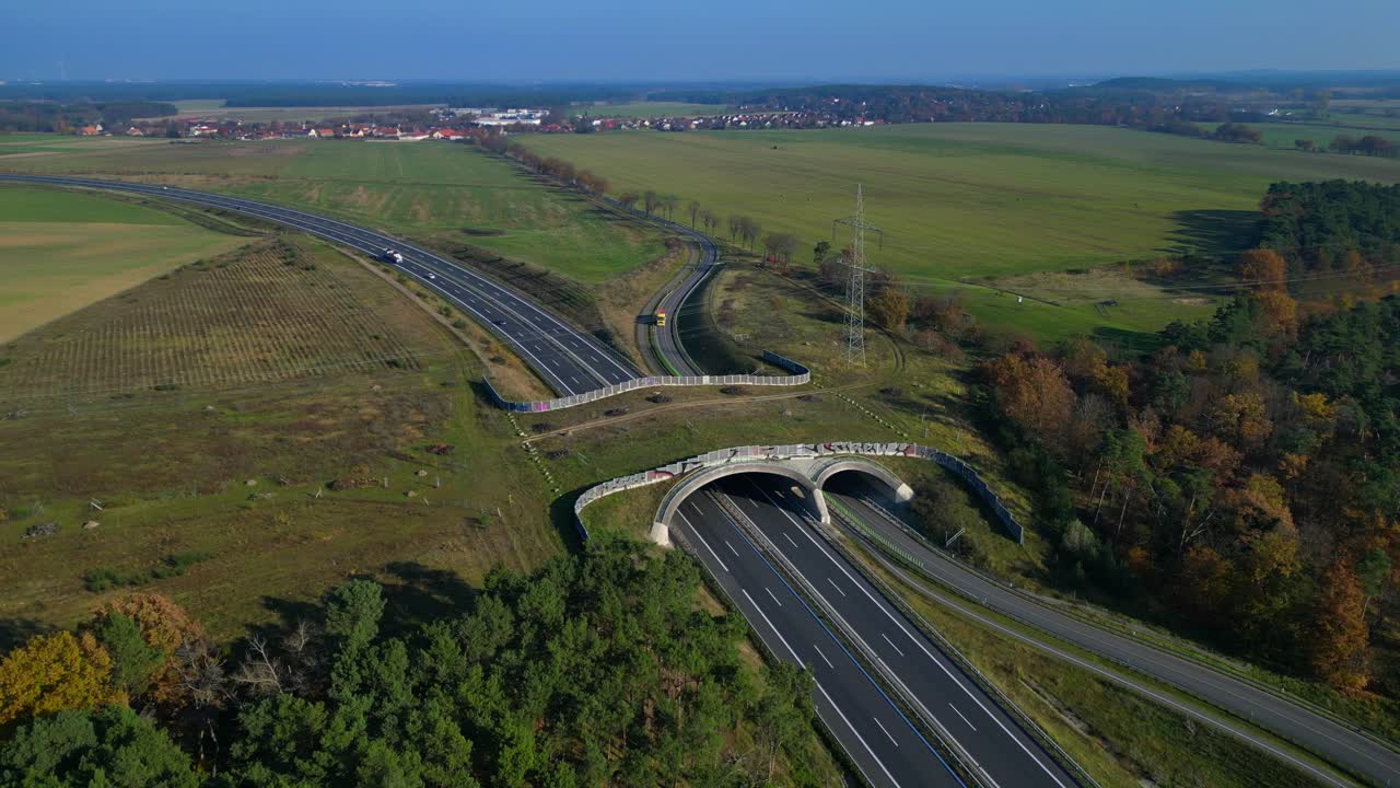 Wildlife crossings Ecoduct, ecopassage, nature ecopassage or green bridge, game changeover. highway in Germany Infrastructure for animals. Lovely aerial view flight panorama orbit drone