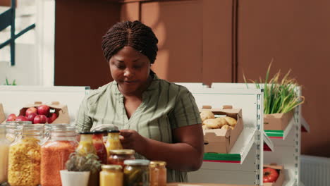 woman client filling in paper bag with pasta sold as bulk item