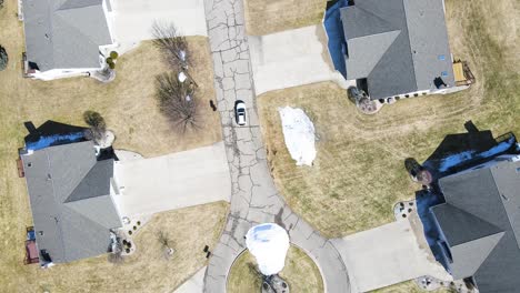 Birdseye-track-of-a-suburban-area-with-identical-homes-in-spring