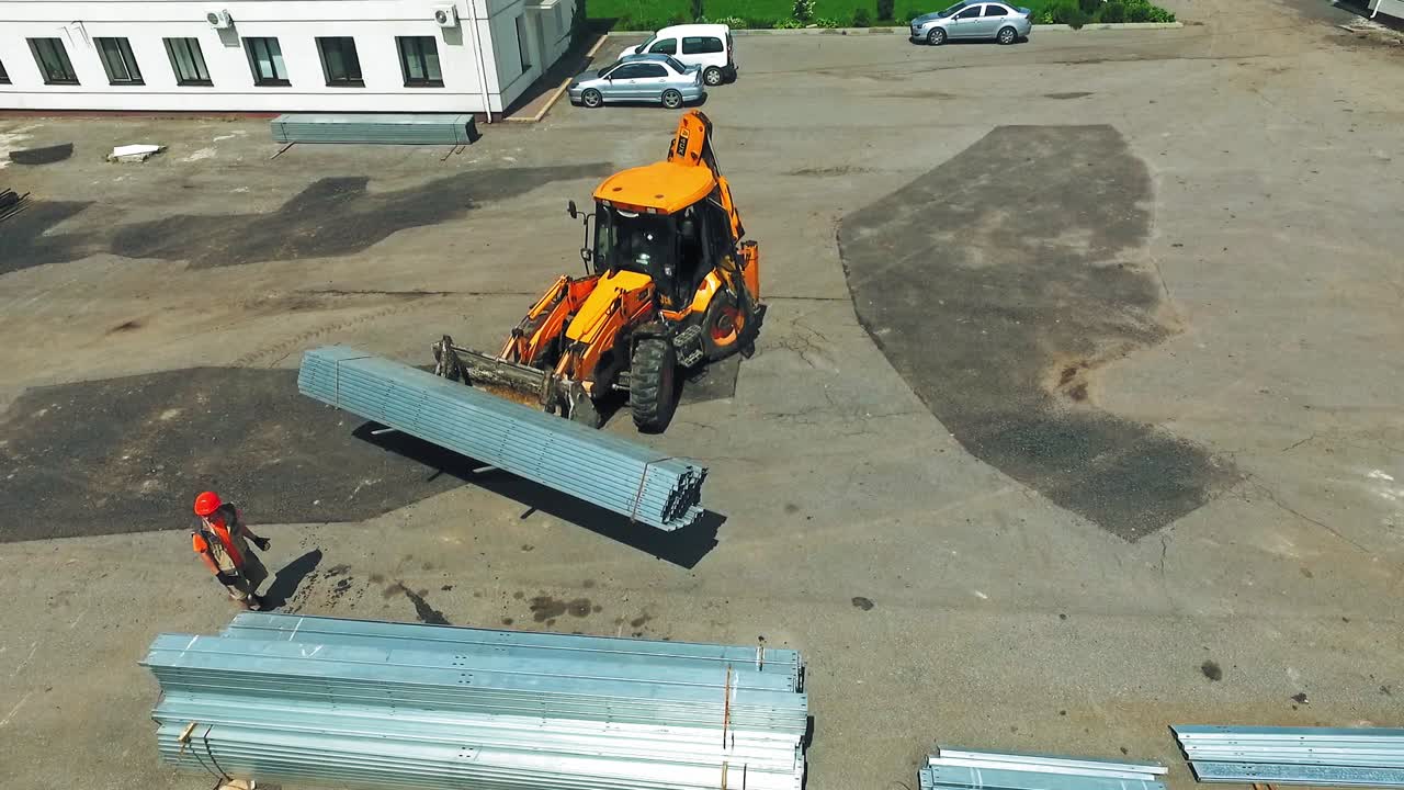 Aerial view of working excavator. Aerial view of industrial excavator working on construction site