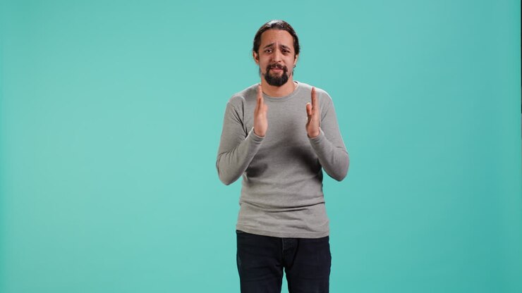 Apologetic person doing sorry gesturing, asking for pardon