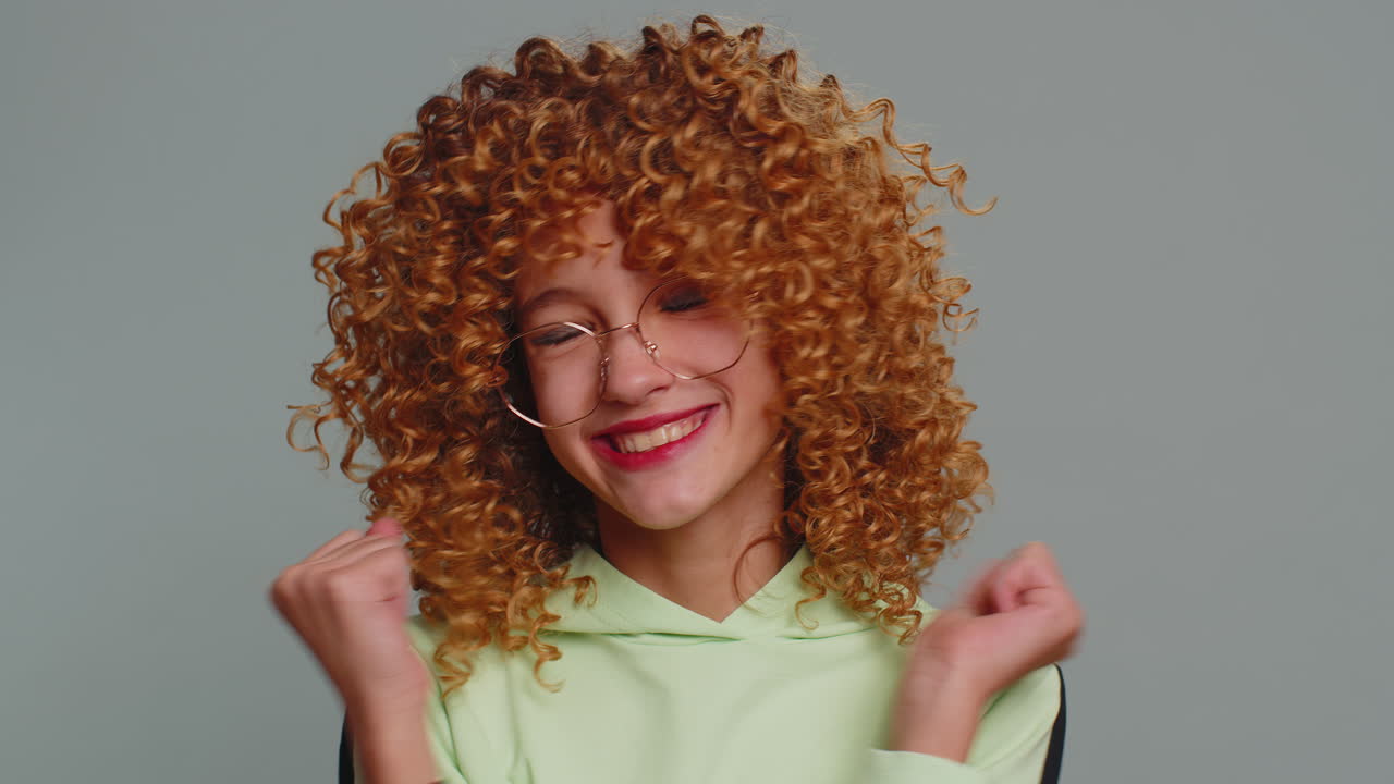 Young teenager child girl kid celebrating success winning birthday lottery jackpot goal achievemen