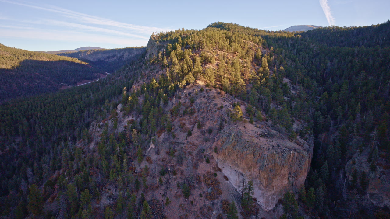 Sweeping aerial shot of eroded canyon landscapes near Los Alamos, New Mexico