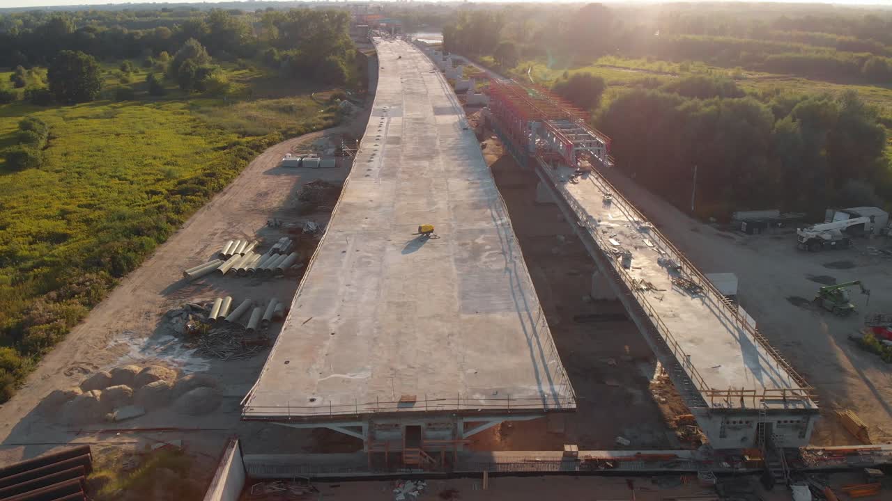 Aerial shot of a construction site with new viaduct in city suburbs