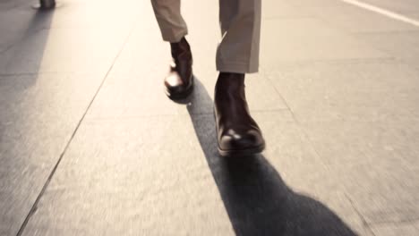 closeup shot of an unrecognisable businessman walking in the city