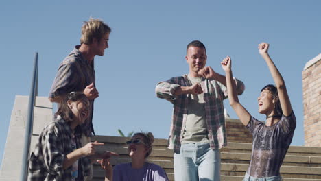 a group of young friends dancing on steps