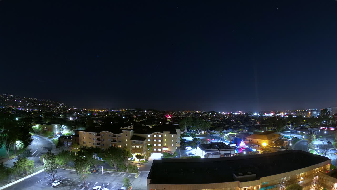 The Colorful City Of Torrance California Surrounded With High Buildings, Cars, And Trees During Nighttime - Time Lapse