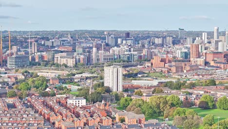 drone shot rising over leeds city centre in england