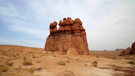 Beautiful-isolated-shot-of-the-famous-Three-Sisters-red-rock-formation-inside-of-the-Utah-State-Park,-Goblin-Valley-on-a-warm-sunny-summer-day