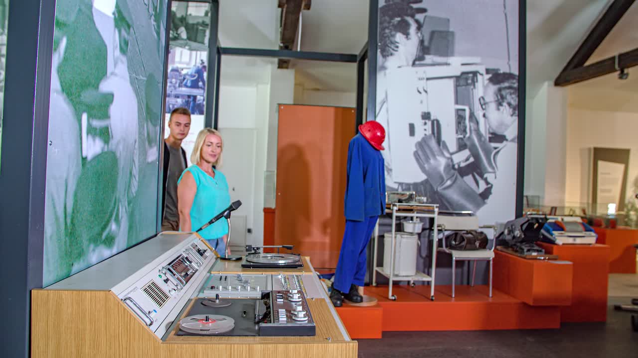 young couple visiting a old radio studio at the Ravne na Koroskem museum